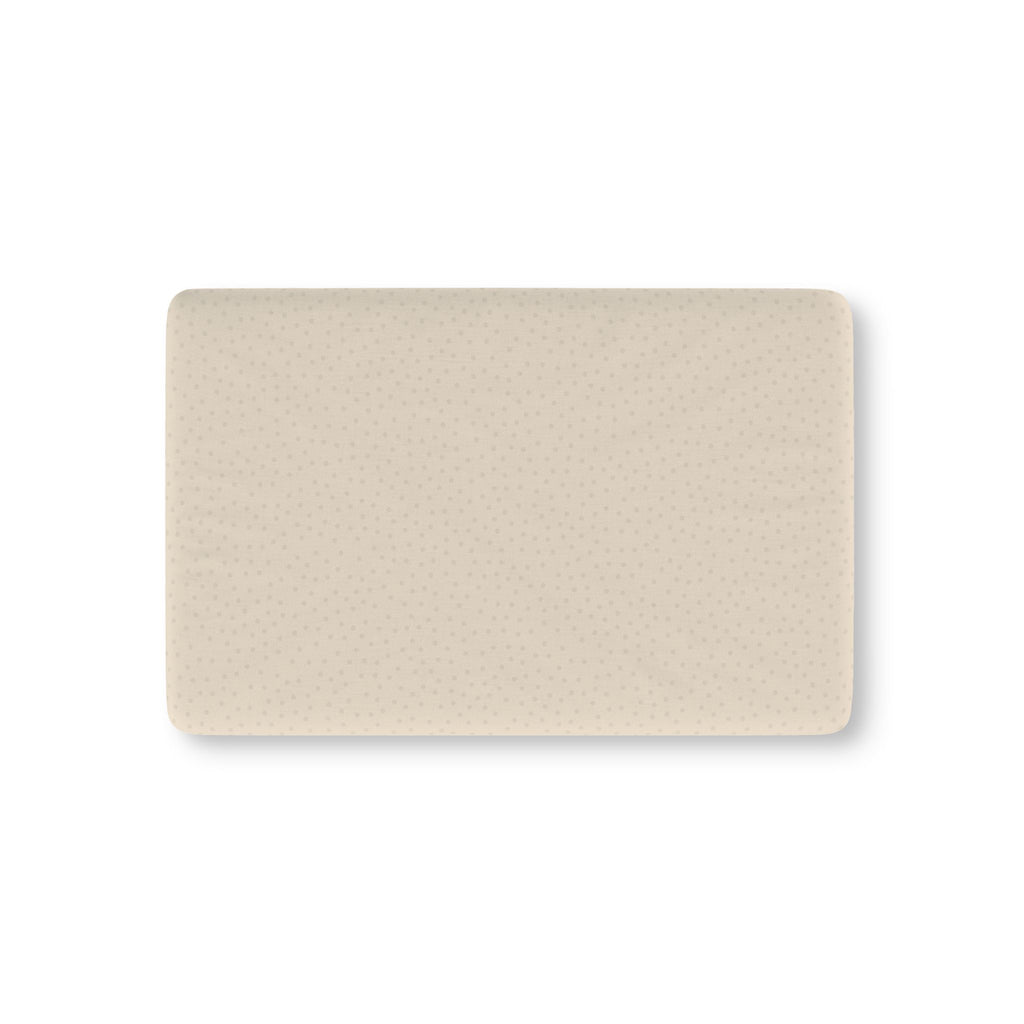 Beige Polka Dot Crib Sheet laid flat in Mini size with small tonal dots on warm beige