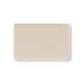 Beige Polka Dot Crib Sheet laid flat in Mini size with small tonal dots on warm beige