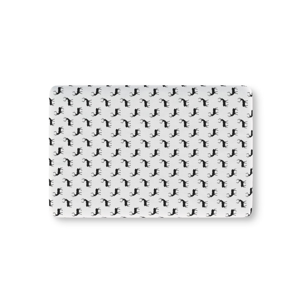 Black Reindeer Crib Sheet laid flat in Mini size with black reindeer silhouettes on white