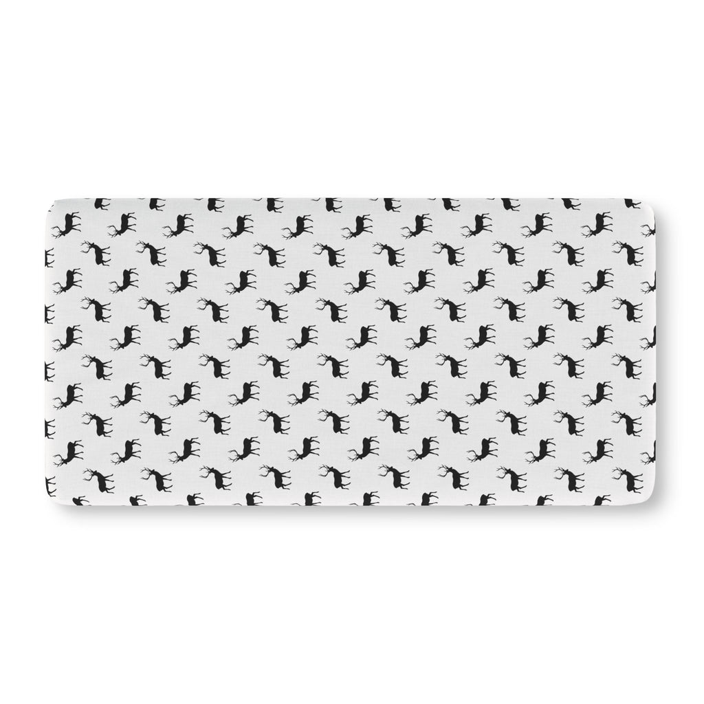 Black Reindeer Crib Sheet laid flat in Standard size with black reindeer silhouettes on white