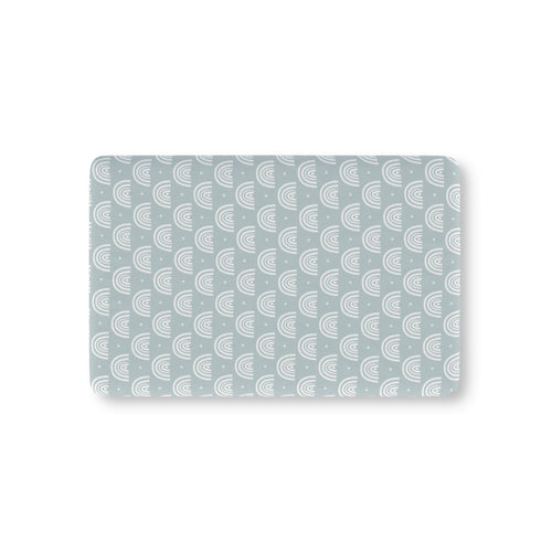 Blue Boho Rainbow Crib Sheet laid flat in Mini size with white rainbow arches on dusty blue