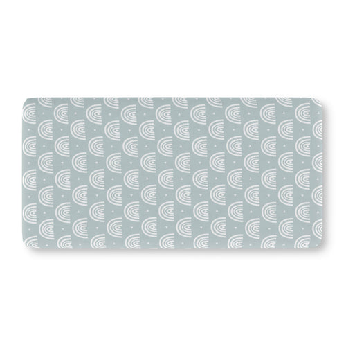 Blue Boho Rainbow Crib Sheet laid flat in Standard size with white rainbow arches on dusty blue