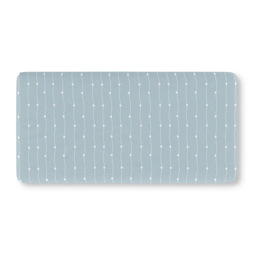Blue Heart Stripe Crib Sheet laid flat in Standard size with wavy white lines and tiny hearts on dusty blue