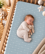 Baby sleeping on the Blue Heart Stripe Crib Sheet