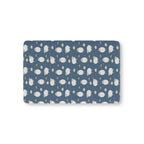 Blue Sheep Crib Sheet laid flat in Mini size with white woolly sheep and tan clouds on dusty blue