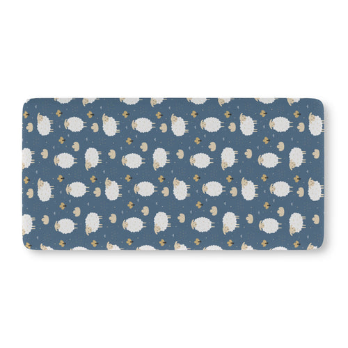 Blue Sheep Crib Sheet laid flat in Standard size with white woolly sheep and tan clouds on dusty blue