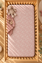 Blush Pink Lace Floral Crib Sheet seen from above in a wooden crib