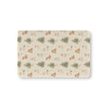 Christmas Puppy Crib Sheet laid flat in Mini size with puppies and little pine trees on cream