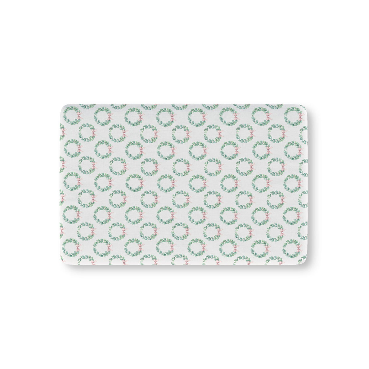 Christmas Wreath Crib Sheet laid flat in Mini size with eucalyptus wreaths and pink bows on white