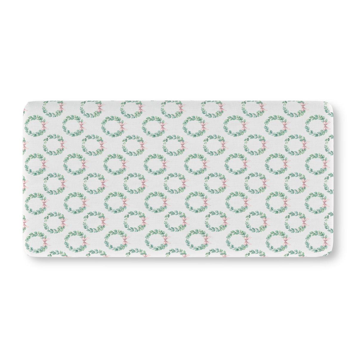 Christmas Wreath Crib Sheet laid flat in Standard size with eucalyptus wreaths and pink bows on white