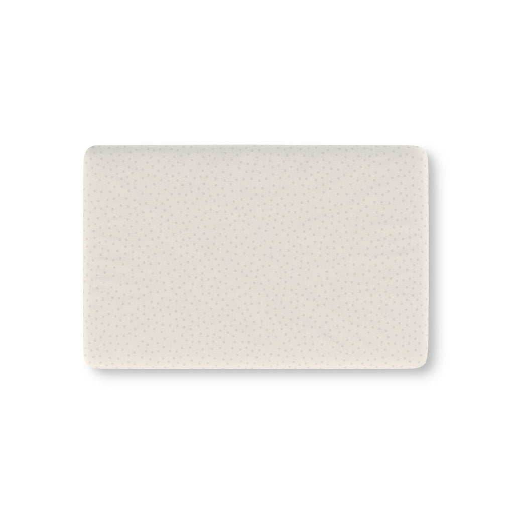Cream Polka Dot Crib Sheet laid flat in Mini size with small gray dots on cream