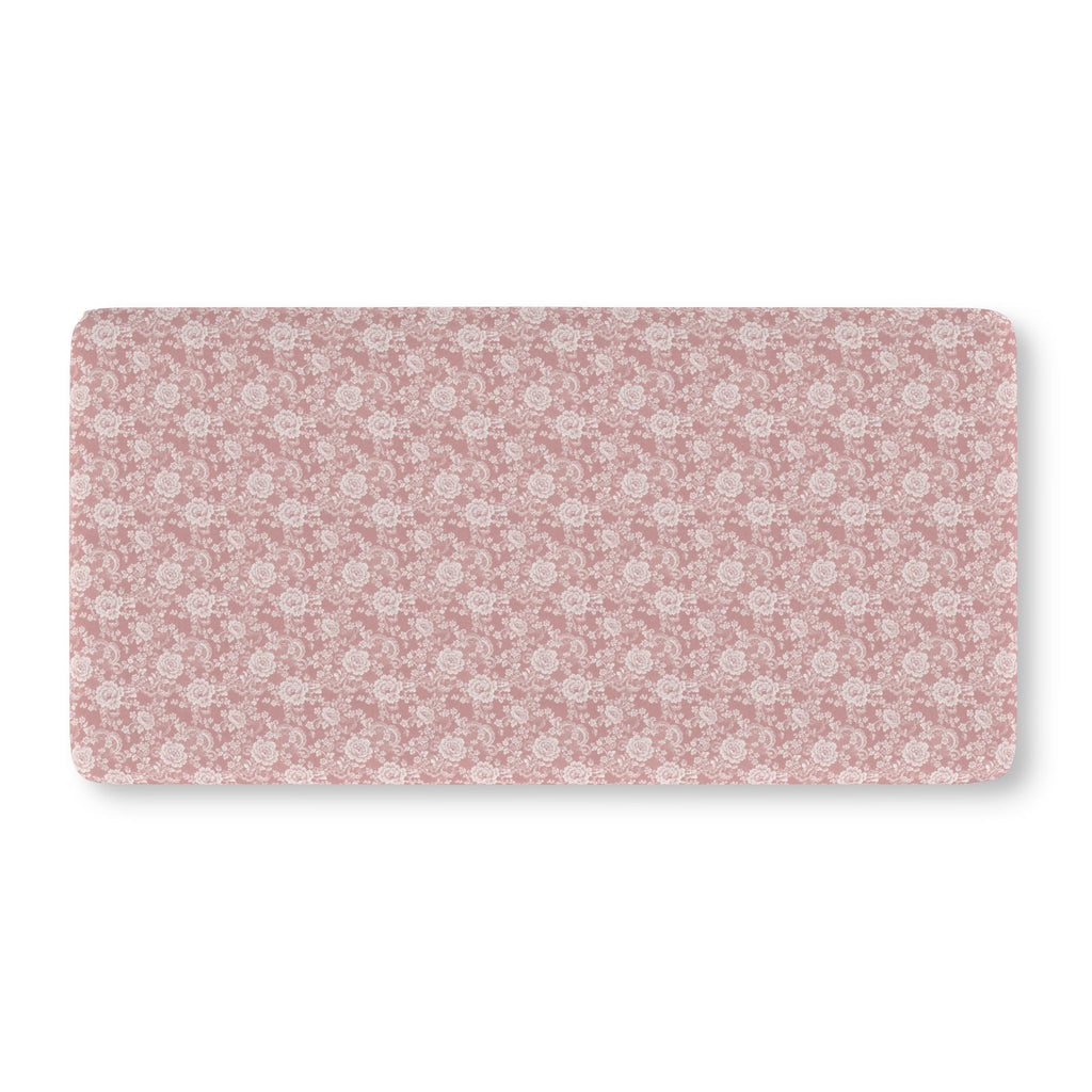 Dusty Rose Lace Floral Crib Sheet laid flat in Standard size with white lace style roses on dusty rose