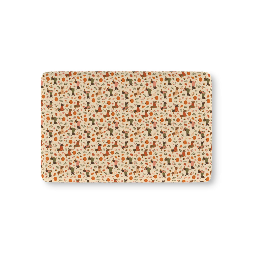 Fall Dachshund Crib Sheet laid flat in Mini size with dachshunds in sweaters, pumpkins and leaves on cream