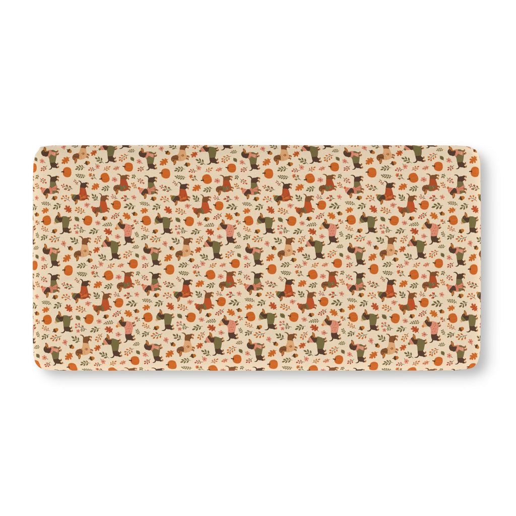 Fall Dachshund Crib Sheet laid flat in Standard size with dachshunds in sweaters, pumpkins and leaves on cream