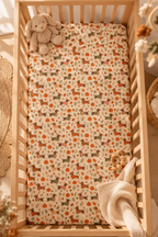 Fall Dachshund Crib Sheet seen from above in a wooden crib