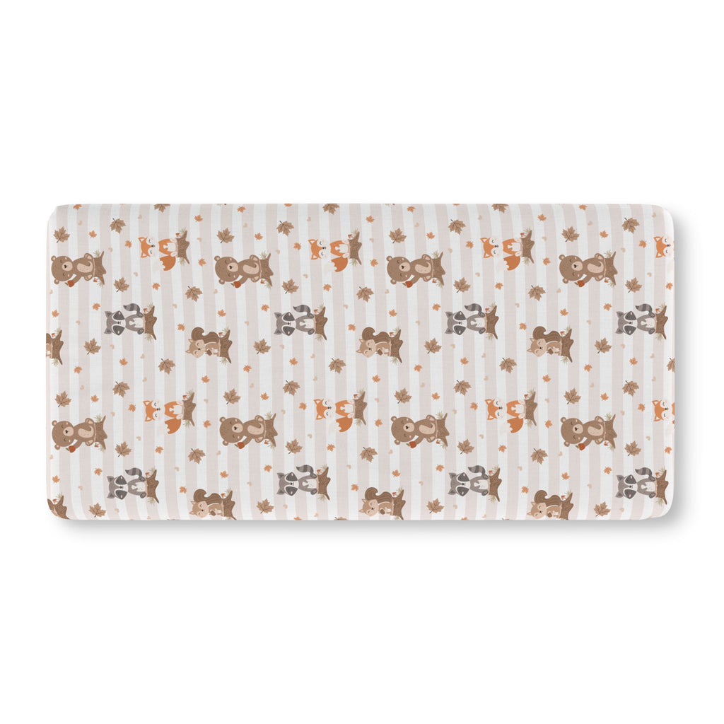 Fall Woodland Animal Crib Sheet laid flat in Standard size with foxes, bears and raccoons on beige stripes