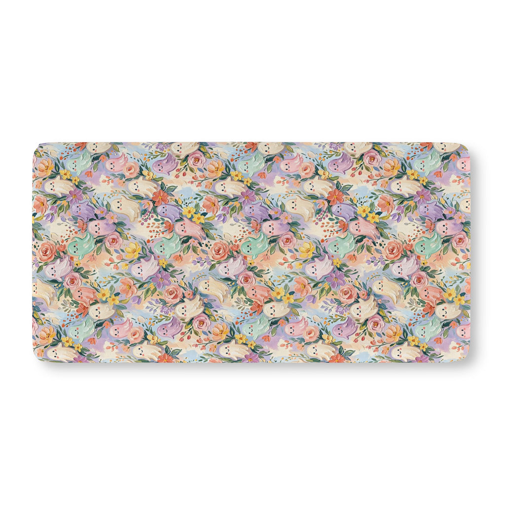 Floral Ghost Crib Sheet laid flat in Standard size with pastel ghosts among painted flowers