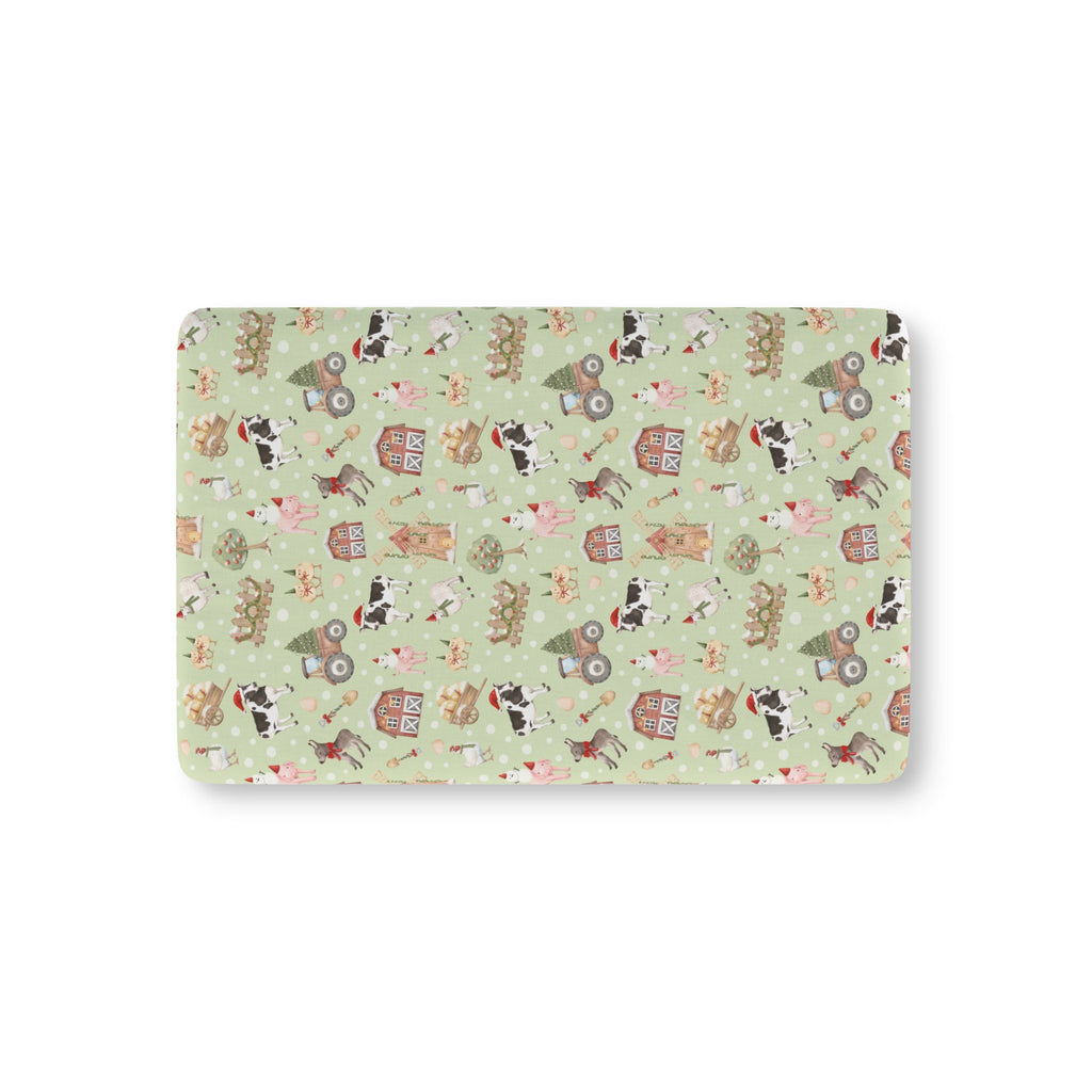 Green Christmas Farm Crib Sheet laid flat in Mini size with farm animals in Santa hats on light green