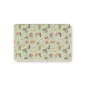 Green Christmas Farm Crib Sheet laid flat in Mini size with farm animals in Santa hats on light green