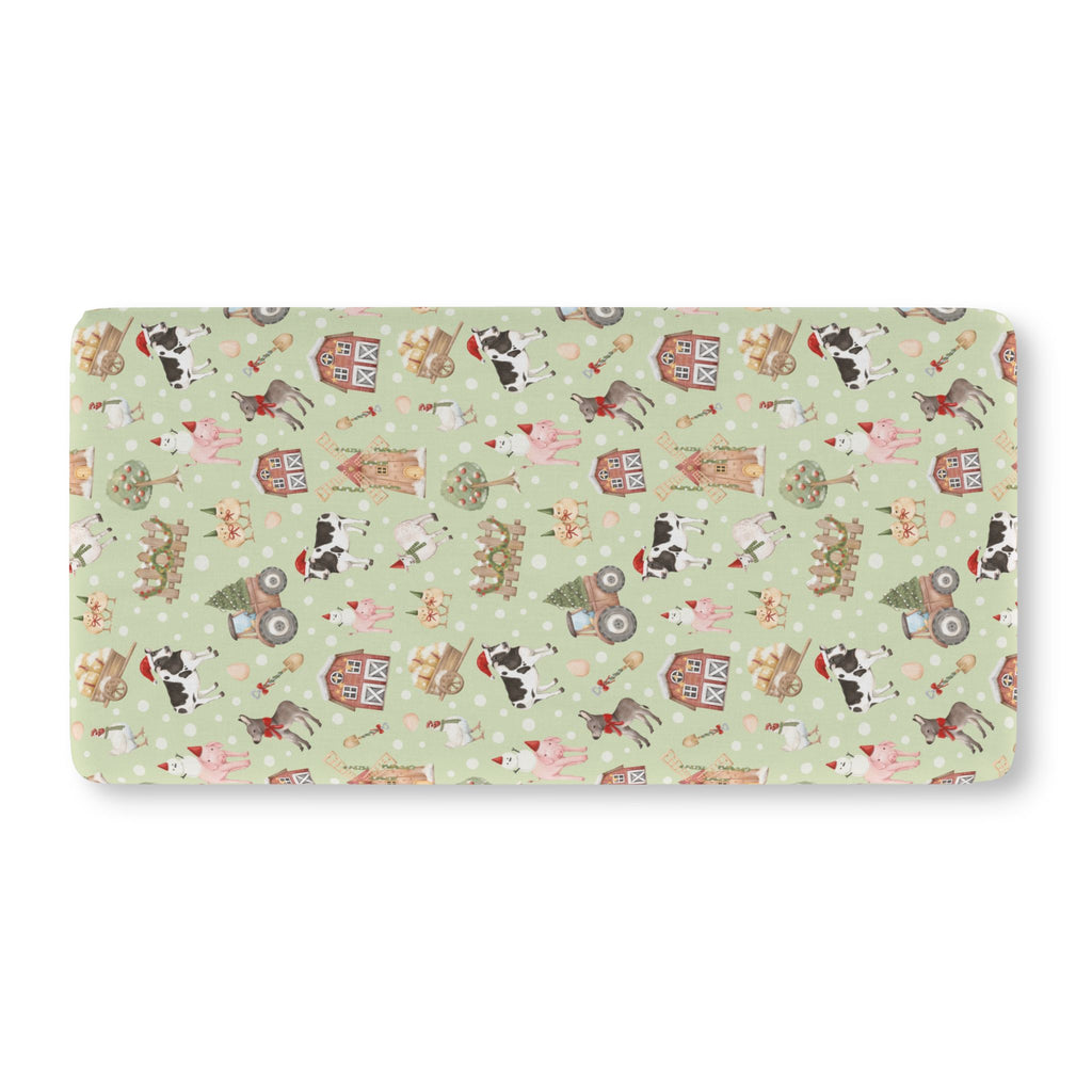 Green Christmas Farm Crib Sheet laid flat in Standard size with farm animals in Santa hats on light green