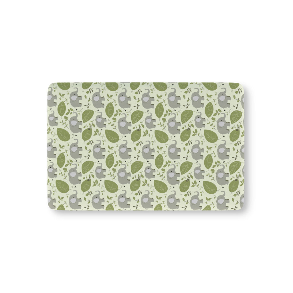 Green Elephant Crib Sheet laid flat in Mini size with gray elephants and green leaves on pale green