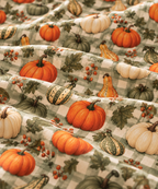Close-up of the Green Gingham Pumpkin Crib Sheet fabric showing pumpkins and gourds on sage green gingham