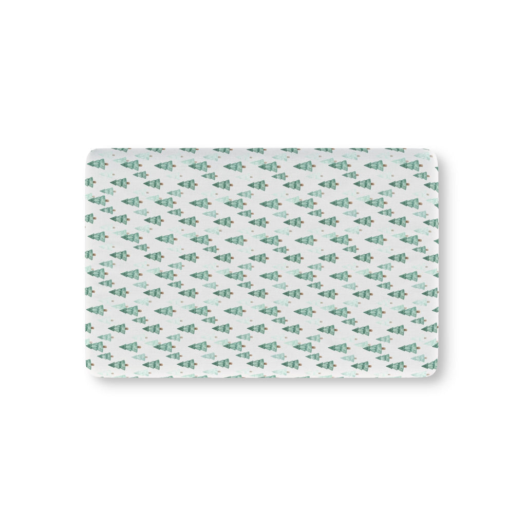 Green Pine Tree Crib Sheet laid flat in Mini size with green watercolor pine trees on white