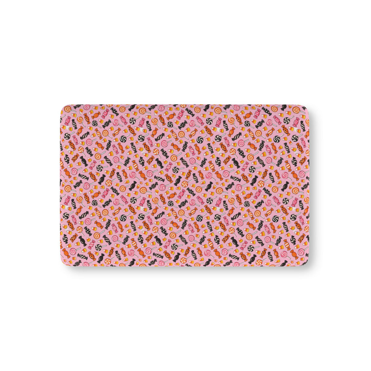 Halloween Candy Crib Sheet laid flat in Mini size with wrapped candy, lollipops and candy corn on pink