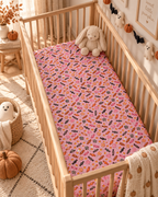 Halloween Candy Crib Sheet on a wooden crib mattress in a Halloween nursery