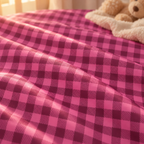 Close-up of the Hot Pink Gingham Crib Sheet fabric showing a hot pink and berry check