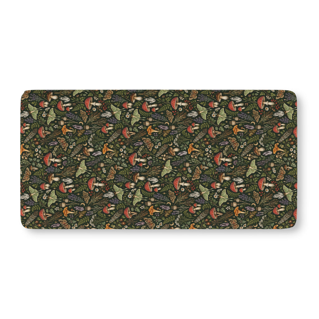 Mushroom Woodland Crib Sheet laid flat in Standard size with red mushrooms, ferns and luna moths on deep green