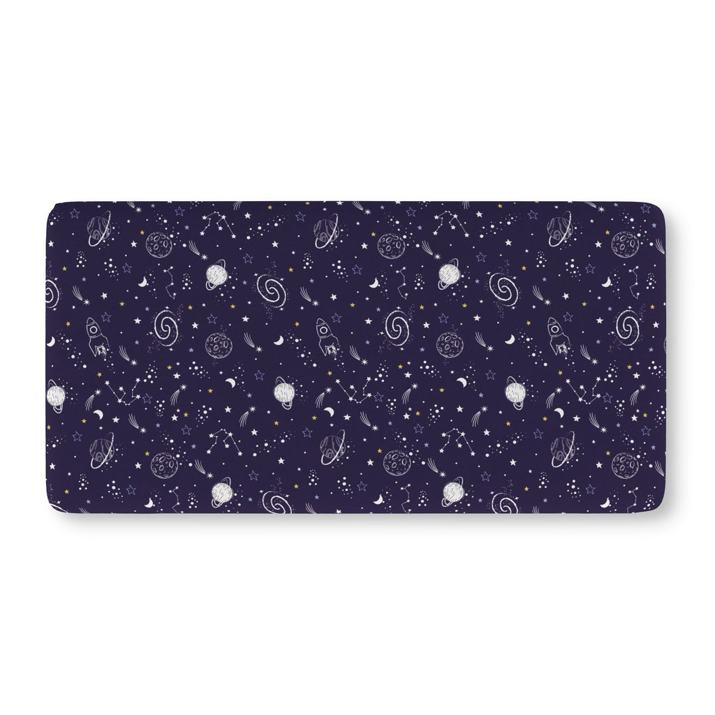 Navy Space Crib Sheet laid flat in Standard size with white planets, moons, rockets and stars on navy