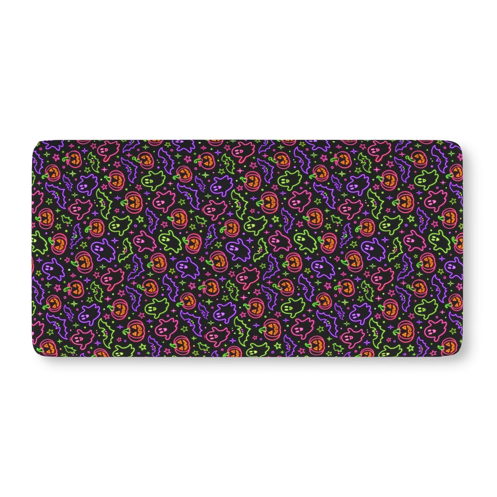 Neon Halloween Crib Sheet laid flat in Standard size with neon ghosts, pumpkins and bats on black