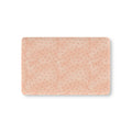 Peach Polka Dot Crib Sheet laid flat in Mini size with watercolor dots on peach pink