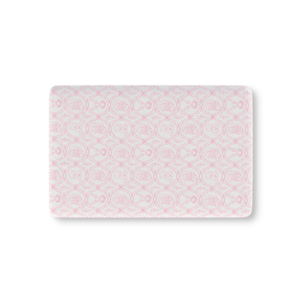 Pink Christmas Toile Crib Sheet laid flat in Mini size with pink Santa and reindeer toile on white