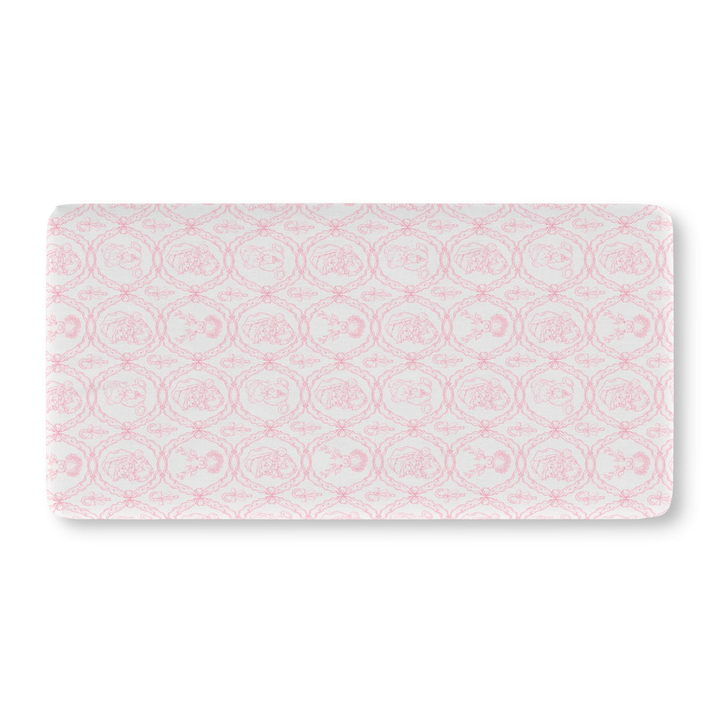 Pink Christmas Toile Crib Sheet laid flat in Standard size with pink Santa and reindeer toile on white