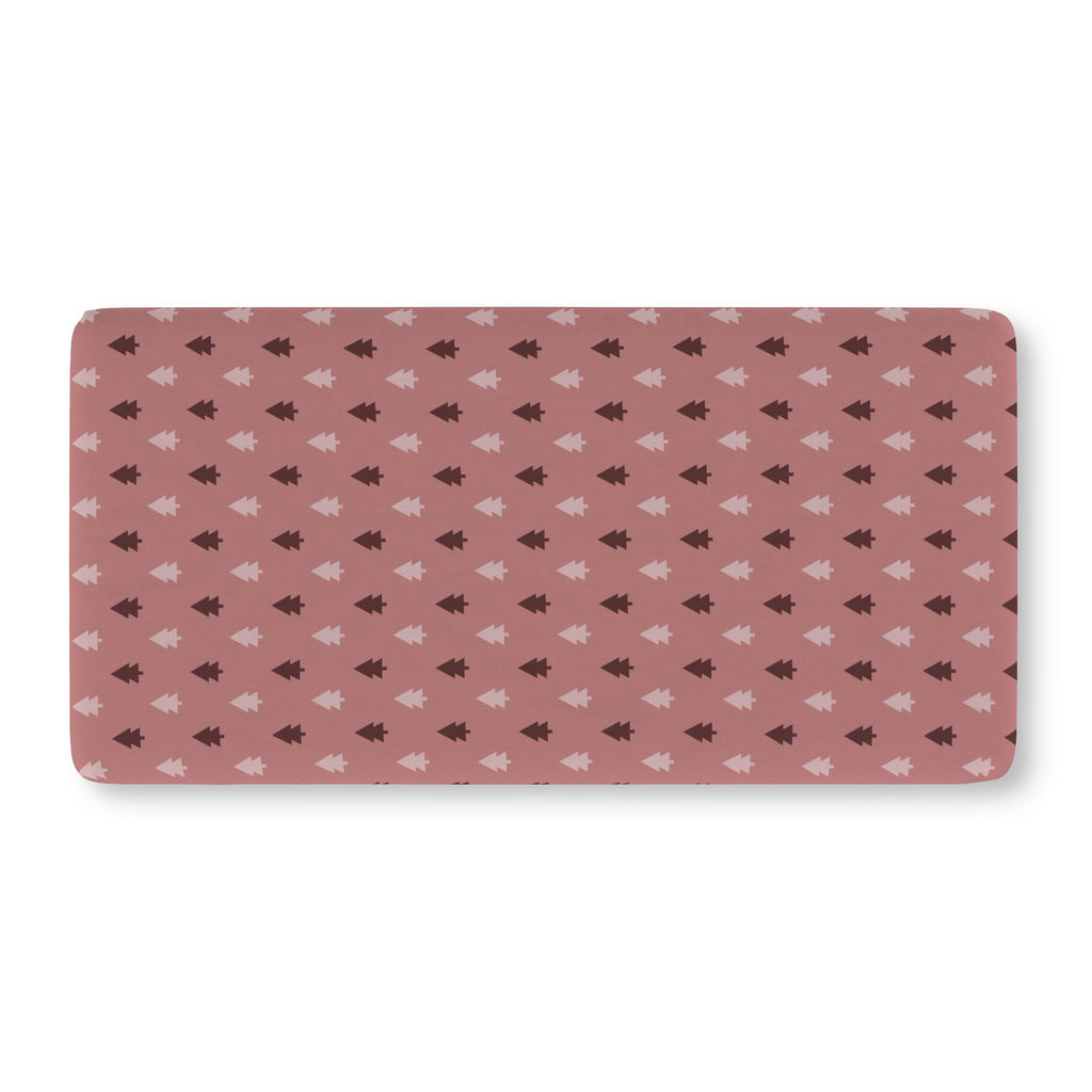 Pink Christmas Tree Crib Sheet laid flat in Standard size with blush and berry Christmas trees on dusty rose