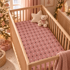 Pink Christmas Tree Crib Sheet on a wooden crib mattress in a Christmas nursery