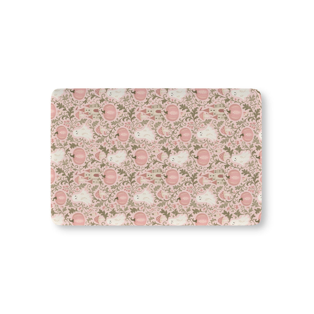 Pink Ghost Garden Crib Sheet laid flat in Mini size with ghosts, pink pumpkins and green vines on pink