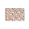 Pink Ghost Garden Crib Sheet laid flat in Mini size with ghosts, pink pumpkins and green vines on pink
