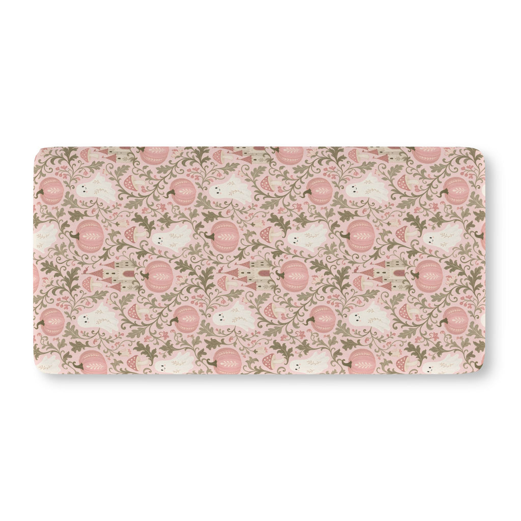 Pink Ghost Garden Crib Sheet laid flat in Standard size with ghosts, pink pumpkins and green vines on pink