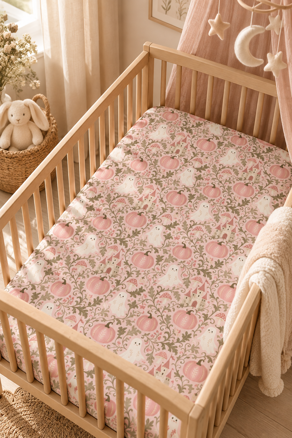 Pink Ghost Garden Crib Sheet on a wooden crib mattress in a baby girl nursery