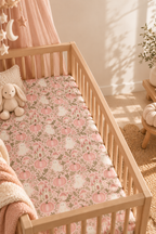 Pink Ghost Garden Crib Sheet in a wooden crib in a sunlit nursery