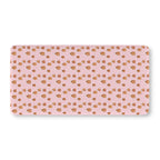 Pink Gingerbread House Crib Sheet laid flat in Standard size with gingerbread houses on pink
