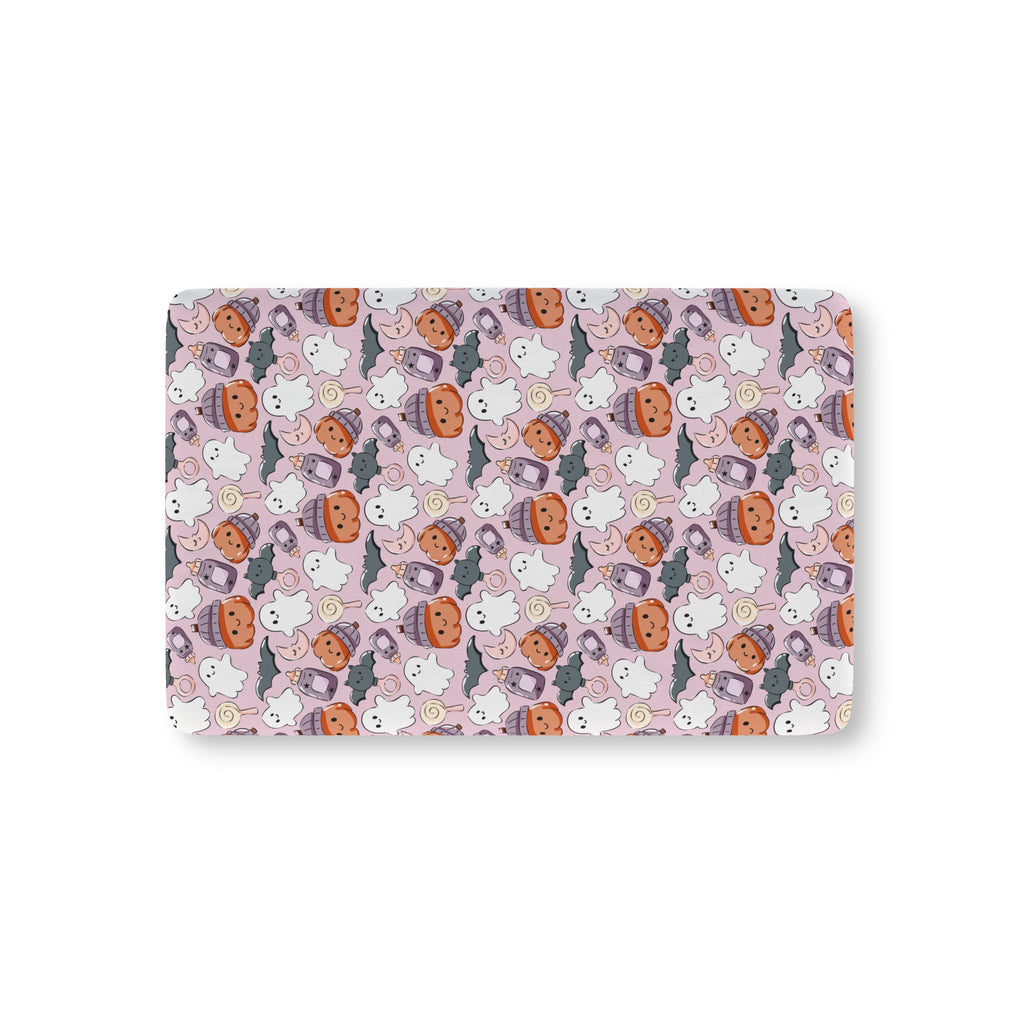 Pink Halloween Ghost Crib Sheet laid flat in Mini size with ghosts, pumpkins and bats on pink