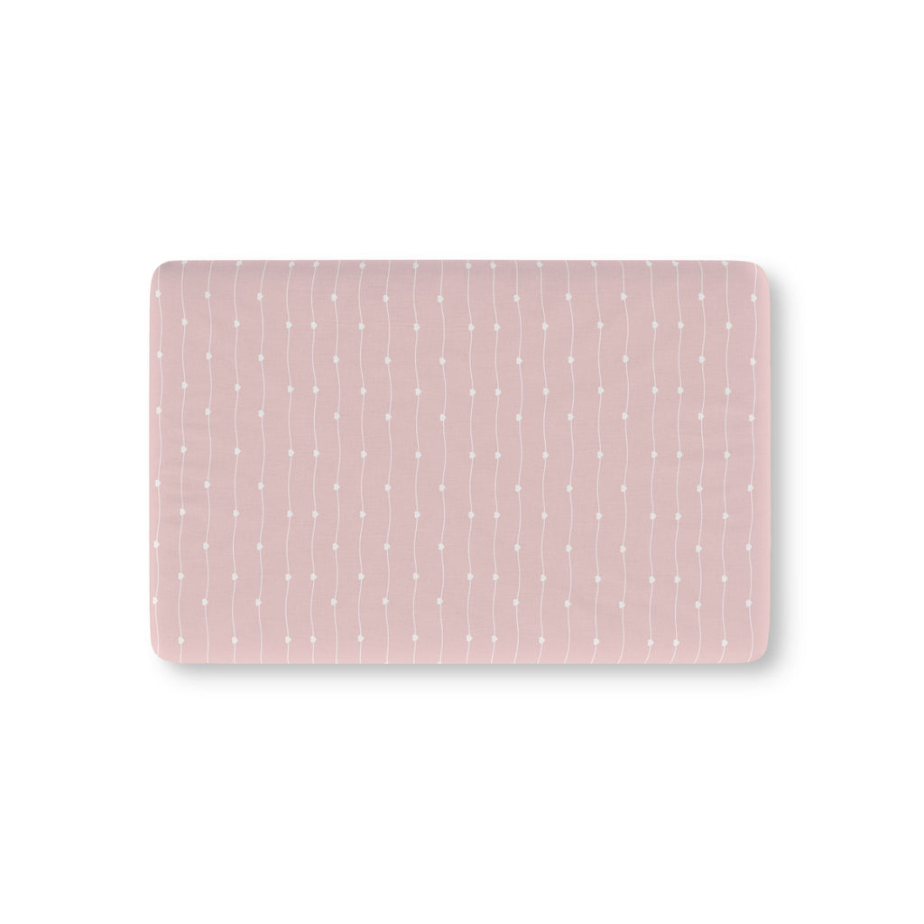 Pink Heart Stripe Crib Sheet laid flat in Mini size with wavy white lines and tiny hearts on dusty pink