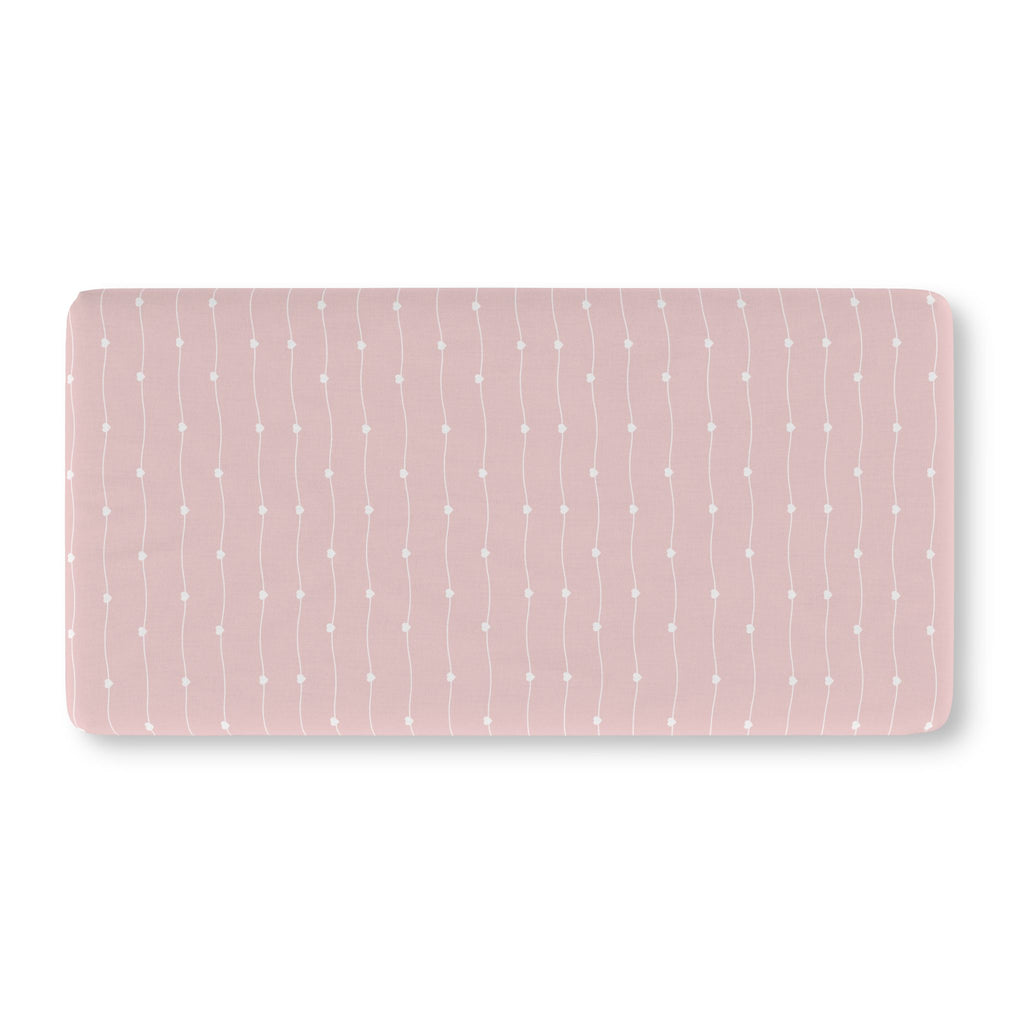 Pink Heart Stripe Crib Sheet laid flat in Standard size with wavy white lines and tiny hearts on dusty pink