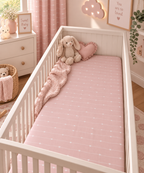 Pink Heart Stripe Crib Sheet on a white crib mattress in a baby girl nursery