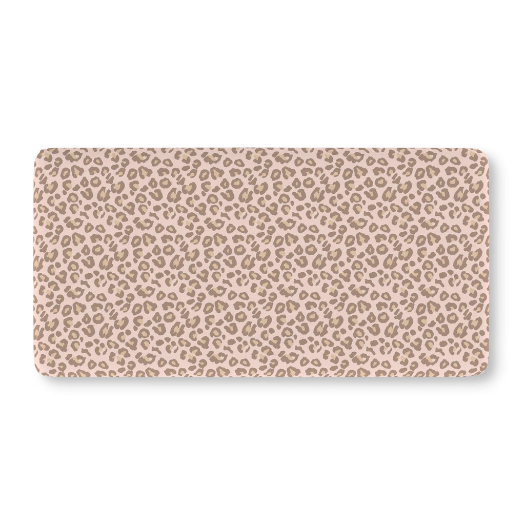Pink Leopard Print Crib Sheet laid flat in Standard size with taupe leopard spots on blush pink