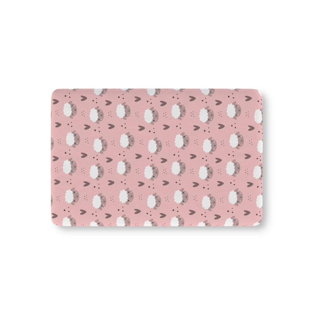 Pink Sheep Crib Sheet laid flat in Mini size with white sheep faces and little hearts on dusty pink